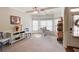 Bright home office featuring a work desk, built-in shelving and two blue chairs at 45 Silver Peak Dr, Covington, GA 30016