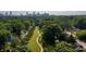 Picturesque aerial view highlighting lush green trees, a walking trail, and the distant city skyline at 59 Stafford Nw St, Atlanta, GA 30314