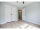 Bright bedroom featuring hardwood floors and ceiling fan at 59 Stafford Nw St, Atlanta, GA 30314