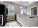 Modern kitchen with white cabinets, stainless steel appliances, and island at 59 Stafford Nw St, Atlanta, GA 30314