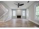 Spacious living room featuring hardwood floors, fireplace, and large windows at 59 Stafford Nw St, Atlanta, GA 30314