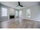 Living room with fireplace, hardwood floors, and large windows at 59 Stafford Nw St, Atlanta, GA 30314