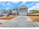 Two-story home with gray siding, attached garage, and a landscaped yard at , Stone Mountain, GA 30087