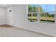 Bright living room with neutral carpeting and large windows at , Stone Mountain, GA 30087