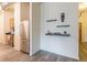 Apartment entryway with stainless steel refrigerator and floating shelves at 120 Ralph Mcgill Ne Blvd # 706, Atlanta, GA 30308