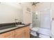 Modern bathroom with granite vanity and a tub shower combo at 120 Ralph Mcgill Ne Blvd # 706, Atlanta, GA 30308