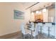 Modern dining area with glass table and white chairs, open to kitchen at 120 Ralph Mcgill Ne Blvd # 706, Atlanta, GA 30308
