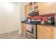 Modern kitchen with wood cabinets, stainless steel appliances, and granite countertops at 120 Ralph Mcgill Ne Blvd # 706, Atlanta, GA 30308
