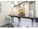 Granite countertop kitchen with breakfast bar and light wood cabinets at 120 Ralph Mcgill Ne Blvd # 706, Atlanta, GA 30308