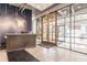 Modern building lobby with reception desk and access to outdoor patio at 120 Ralph Mcgill Ne Blvd # 706, Atlanta, GA 30308