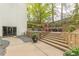Community patio with stairs leading to landscaped grounds at 120 Ralph Mcgill Ne Blvd # 706, Atlanta, GA 30308