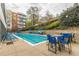 Refreshing community pool with lounge chairs and tables at 120 Ralph Mcgill Ne Blvd # 706, Atlanta, GA 30308