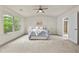 Bright bedroom showcases neutral decor, a modern ceiling fan, and a view to a spa-like ensuite at 2396 Whiteoak Se Bnd # 16, Smyrna, GA 30080