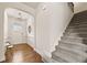Entryway featuring hardwood floors, staircase, and a decorative mirror at 2396 Whiteoak Se Bnd # 16, Smyrna, GA 30080