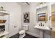 Modern bathroom with white pedestal sink and fixtures at 400 Village Ne Pkwy # 120, Atlanta, GA 30306