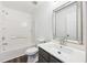 Modern bathroom with gray vanity and shower/tub combo at 5547 Strathmoor Manor Cir, Lithonia, GA 30058