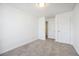 Simple bedroom featuring neutral walls and carpet at 5547 Strathmoor Manor Cir, Lithonia, GA 30058