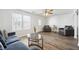 Living room with gray sofas and a ceiling fan at 5547 Strathmoor Manor Cir, Lithonia, GA 30058