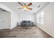 Living room with gray sofa and glass coffee table at 5547 Strathmoor Manor Cir, Lithonia, GA 30058