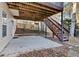 Concrete patio below a deck, providing additional outdoor space at 1395 Heatherton Rd, Dacula, GA 30019