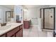 Bathroom with double vanity, shower, and soaking tub at 108 Kasey Dr, Woodstock, GA 30189