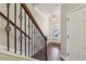 Interior view of a staircase with dark wood railing and hardwood floors at 108 Kasey Dr, Woodstock, GA 30189