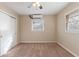 Bedroom with ceiling fan and carpet flooring, access to hallway at 2473 Tyler Way, Decatur, GA 30032