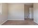 Simple bedroom with neutral walls and carpet flooring at 2473 Tyler Way, Decatur, GA 30032