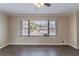 Bright living room with large window and ceiling fan at 2473 Tyler Way, Decatur, GA 30032