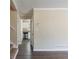 Living room with dark laminate floors and kitchen view at 2473 Tyler Way, Decatur, GA 30032