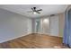 Spacious bedroom featuring wood-look floors and ceiling fan at 7309 Cardigan Cir, Atlanta, GA 30328