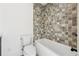 Clean bathroom with tiled shower and bathtub at 10861 Serenbe Ln, Chattahoochee Hills, GA 30268