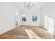 Bright bedroom with hardwood floors and a chandelier at 10861 Serenbe Ln, Chattahoochee Hills, GA 30268