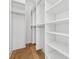 Spacious walk-in closet with ample shelving and hanging space at 10861 Serenbe Ln, Chattahoochee Hills, GA 30268