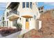 Modern home's front entrance with wood door and walkway at 10861 Serenbe Ln, Chattahoochee Hills, GA 30268