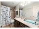 Bathroom with tub shower combo and glass-topped vanity at 1159 Morley Se Ave, Atlanta, GA 30312