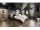 Dark-ceilinged bedroom with hardwood floors and a king-size bed at 1159 Morley Se Ave, Atlanta, GA 30312