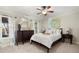 Bedroom with carpeted floor, ceiling fan and a queen-size bed at 1159 Morley Se Ave, Atlanta, GA 30312