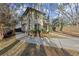 Two-story house showcasing a side view, with a curved driveway and landscaping at 1159 Morley Se Ave, Atlanta, GA 30312