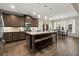 Open concept kitchen boasts granite countertops, stainless steel appliances & island at 1159 Morley Se Ave, Atlanta, GA 30312