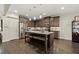 Spacious kitchen featuring granite countertops, stainless steel appliances, and an island with seating at 1159 Morley Se Ave, Atlanta, GA 30312