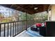 Cozy covered porch with outdoor seating and wooded views at 1159 Morley Se Ave, Atlanta, GA 30312