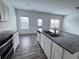 Open concept kitchen with island, granite countertops, and stainless steel appliances at 1394 Ben Park Way, Grayson, GA 30017