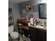 Bathroom with double vanity, shower, and storage at 3195 Newcastle Way, Snellville, GA 30039