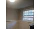 Small basement bedroom with window and brick accent wall at 3195 Newcastle Way, Snellville, GA 30039