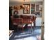 Bright dining room featuring a wood table and chairs, hardwood floors, and artwork at 3195 Newcastle Way, Snellville, GA 30039