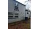 Side view of the house showcasing gray siding and new AC unit at 3195 Newcastle Way, Snellville, GA 30039