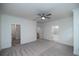 Spacious main bedroom with carpet, ceiling fan and en-suite bathroom at 705 Dodd N Ln # 163, Buford, GA 30518