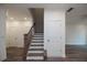 Modern staircase with dark wood railing and white risers at 705 Dodd N Ln # 163, Buford, GA 30518