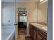 Bathroom with double vanity, garden tub, and view of bedroom at 113 Omega Ct, Dallas, GA 30157